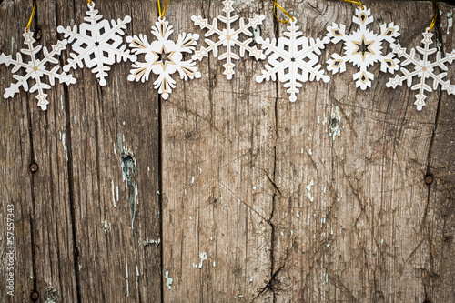 Snowflakes border on wood
