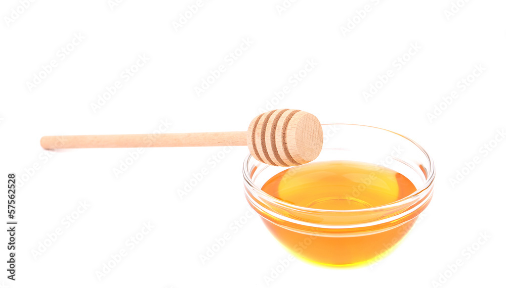 Wooden spoon on bowl with honey. Wooden spoon on bowl with honey.