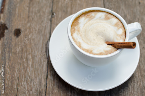 A cup of hot latte with cinnamon