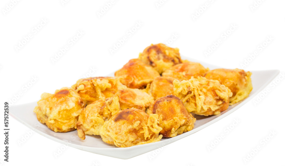 Fried chempedak arils in a white plate. Fried chempedak arils in a white plate.