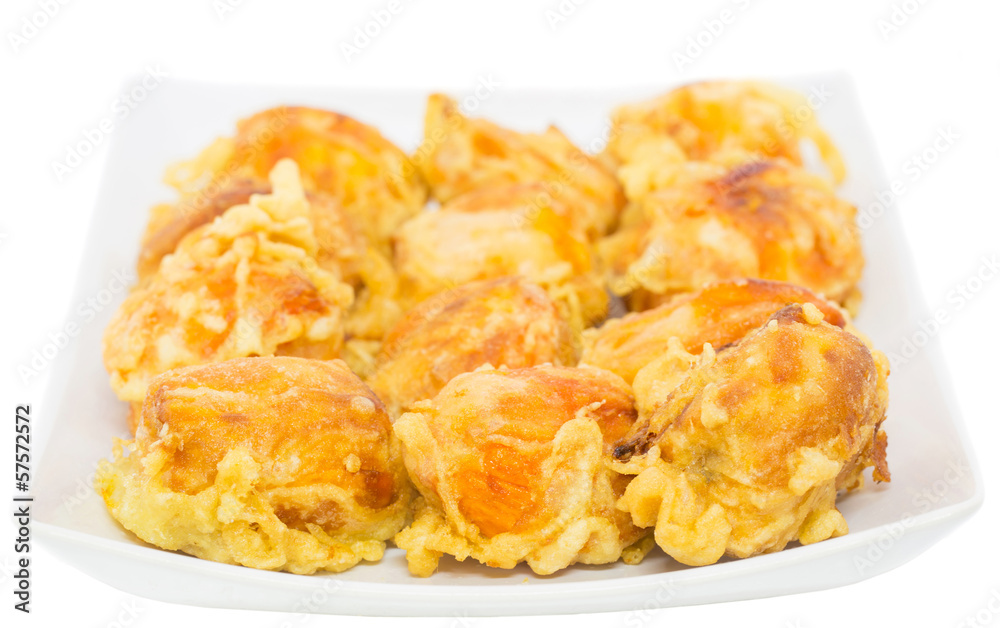 Fried chempedak arils in a white plate. Fried chempedak arils in a white plate.