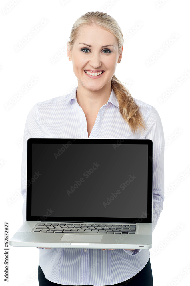 Saleswoman presenting brand new laptop Saleswoman presenting brand new laptop