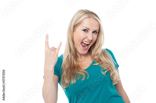 Cool caucasian showing rock on gesture