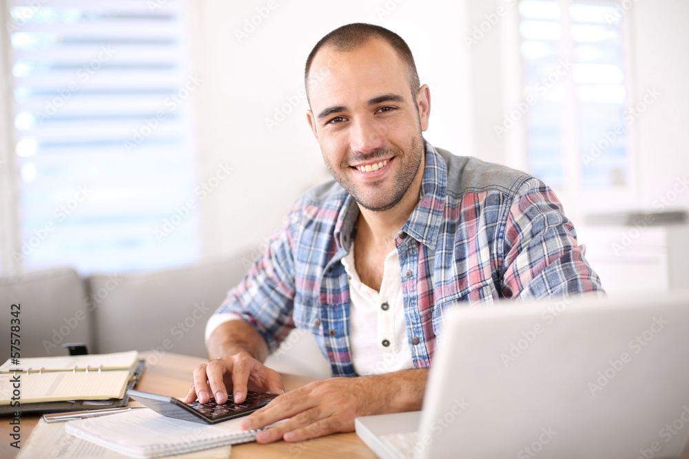 Photography Man working on laptop computer from home