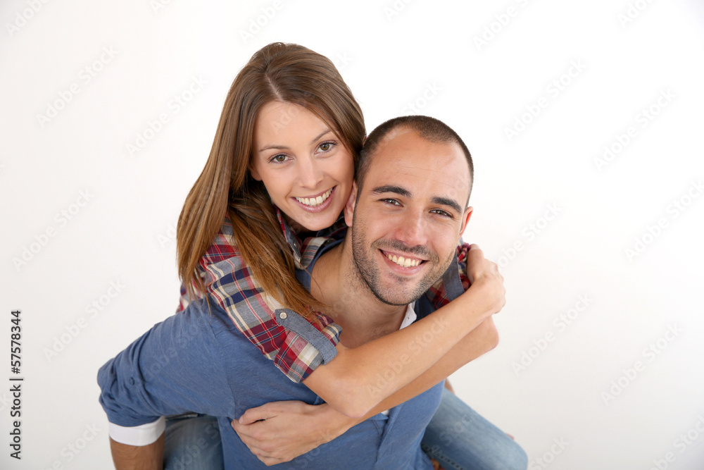 Man giving piggyback ride to girlfriend Man giving piggyback ride to girlfriend