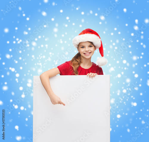 woman in santa helper hat with blank white board