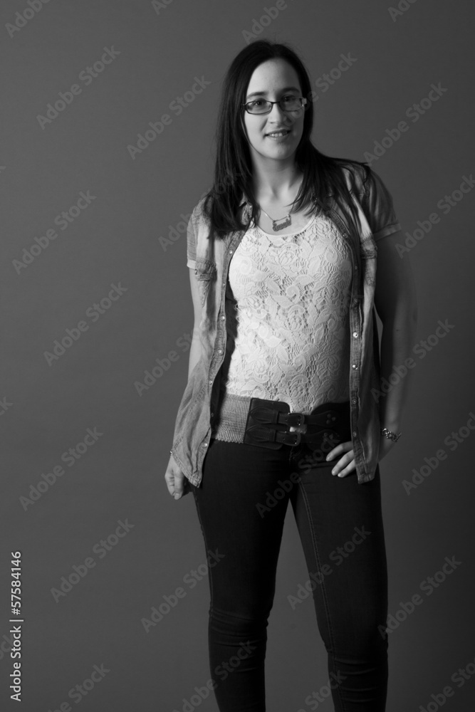 The photo shows a girl with glasses posing The photo shows a girl with glasses posing