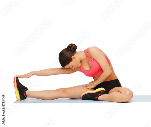 sporty woman doing exercise on the floor