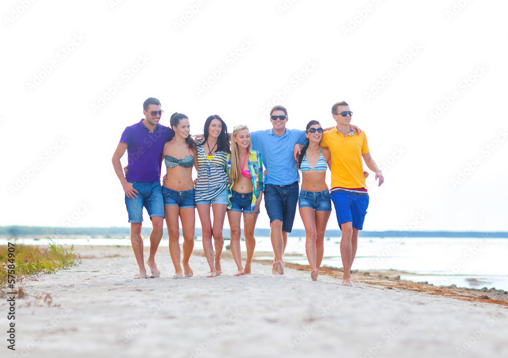 group of friends having fun on the beach