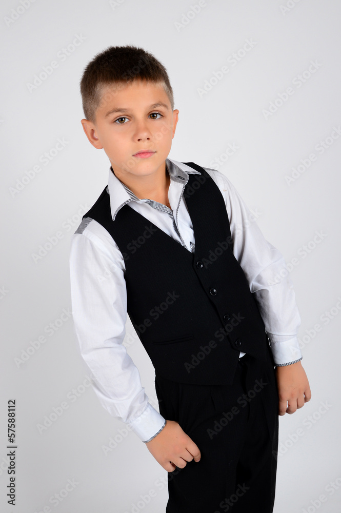 A school boy in school uniform posing in studio A school boy in school uniform posing in studio