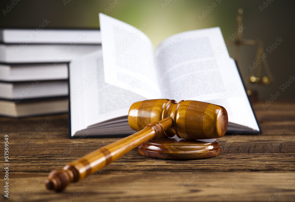 Wooden gavel and books 