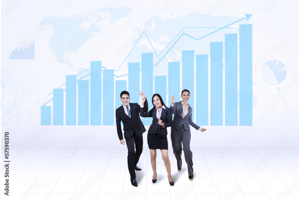 Happy business team with growth graph