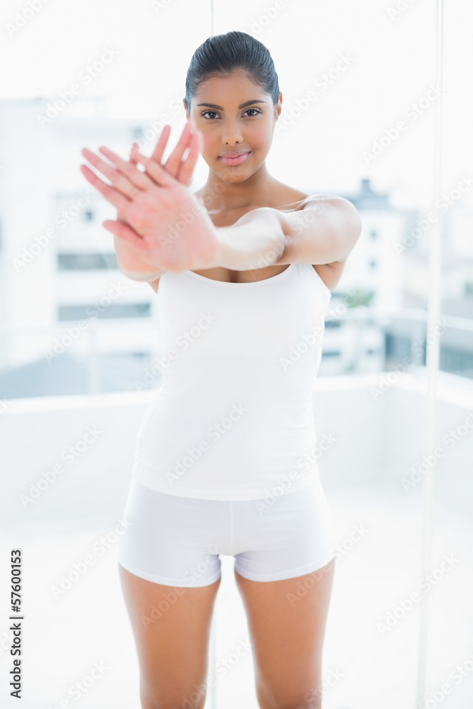 Smiling toned brunette standing defensive Smiling toned brunette standing defensive