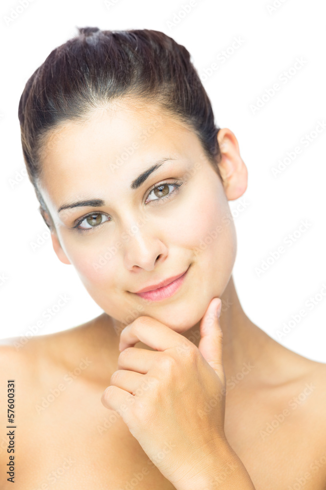 Front view of thoughtful woman smiling at camera Front view of thoughtful woman smiling at camera