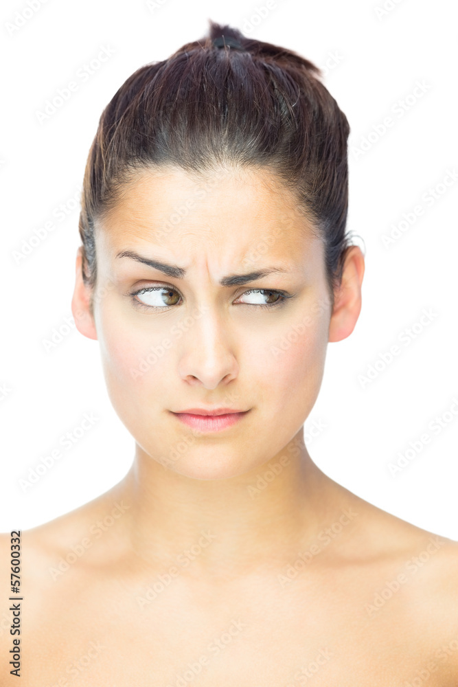 Front view of beautiful sceptical woman looking away