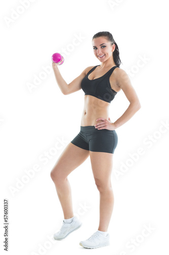 Fit slender woman training her arm