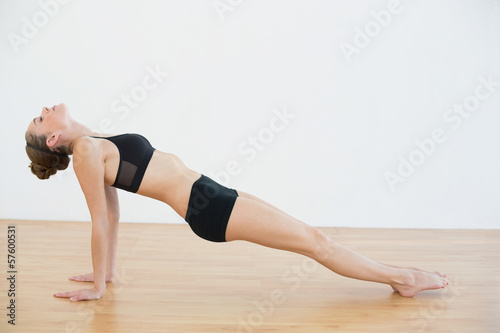 Fototapeta Naklejka Na Ścianę i Meble -  Slender woman doing yoga pose