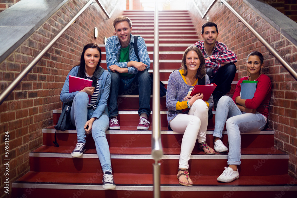 Fototapeta premium College students sitting on stairs in the college