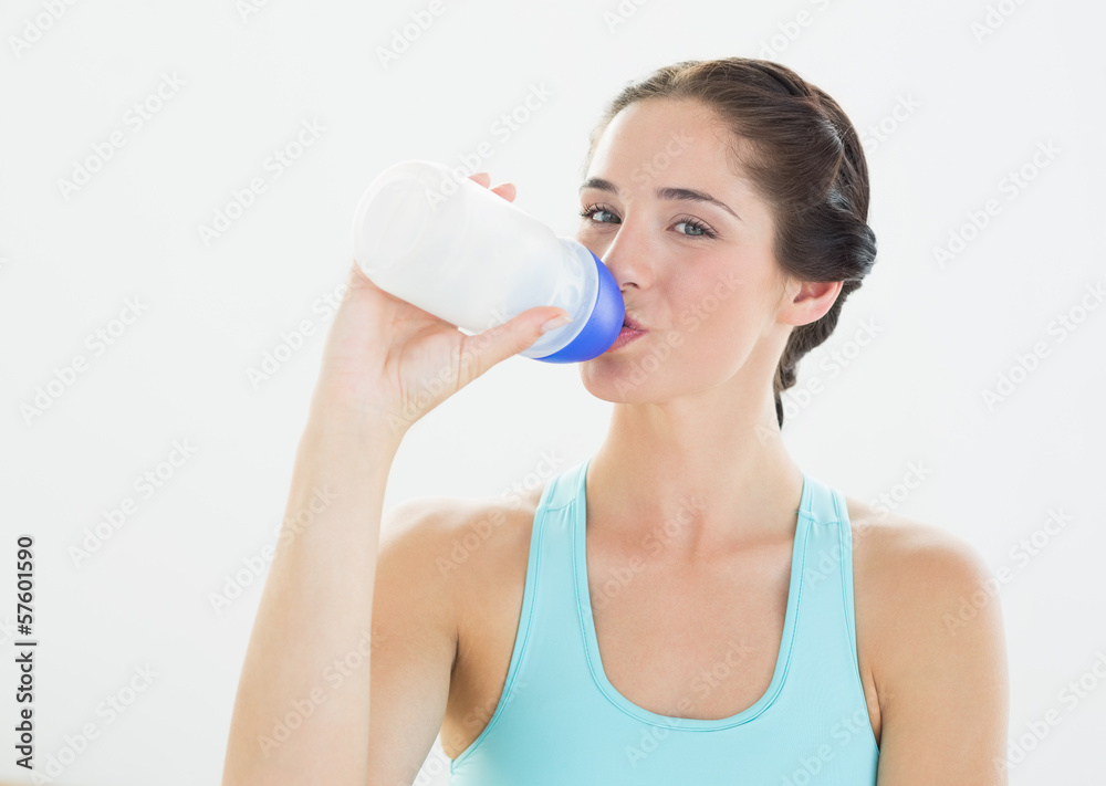 Portrait of a sporty woman drinking water Portrait of a sporty woman drinking water