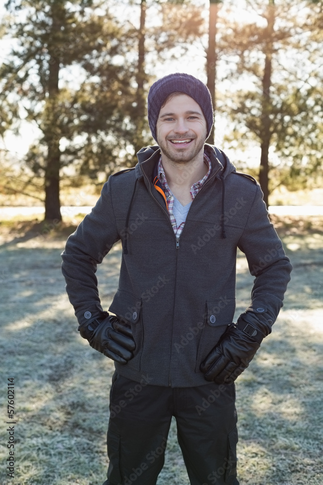 Portrait of a young man in warm clothing in forest Portrait of a young man in warm clothing in forest