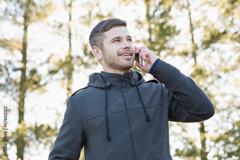 Smiling man using mobile phone outdoors Smiling man using mobile phone outdoors
