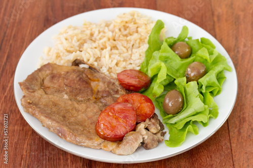 fried meat with rice and salad