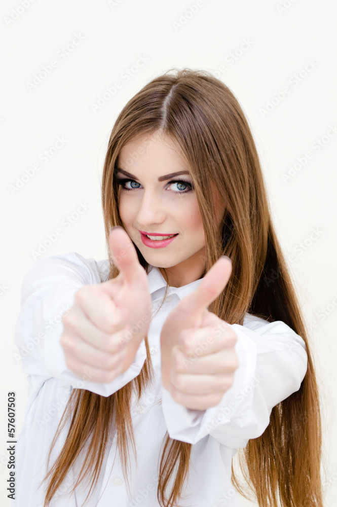 Young business woman wearing man's shirt showing thumbs up Young business woman wearing man's shirt showing thumbs up