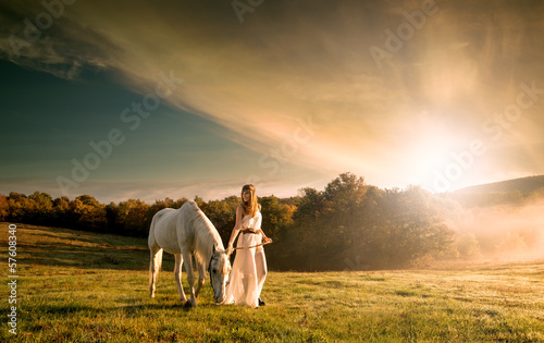 Beautiful sensual women with white horse