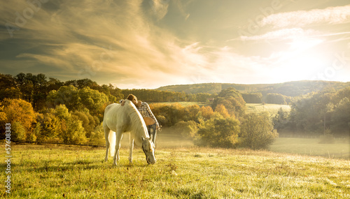 Beautiful sensual women with white horse
