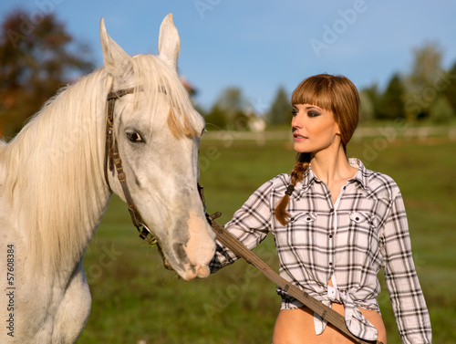 Portrait of a white horse and woman
