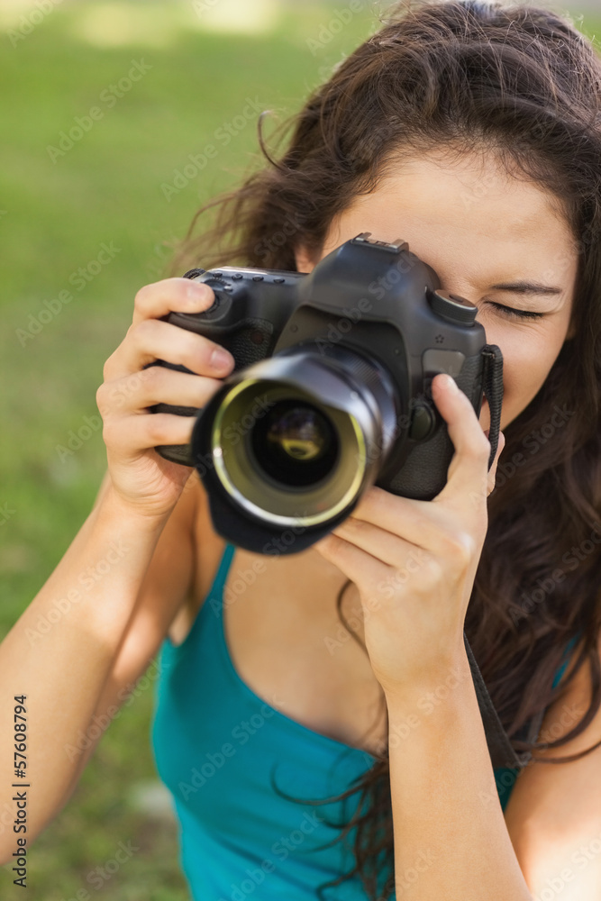 Gorgeous peaceful woman using her camera Gorgeous peaceful woman using her camera