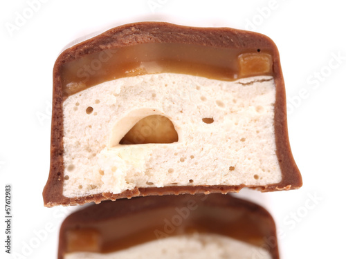 Slices bar of chocolate with peanuts