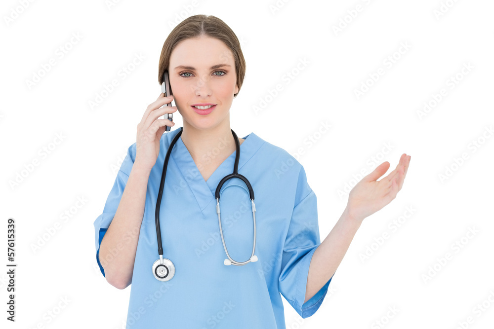 Young woman doctor phoning and making a gesture Young woman doctor phoning and making a gesture