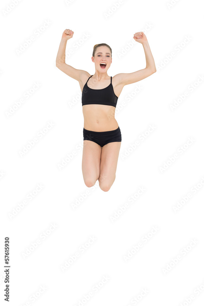 Strong slim model jumping in the air