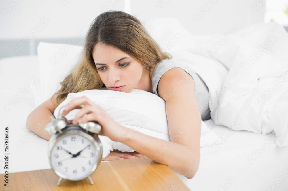 Gorgeous tired woman lying on her bed Gorgeous tired woman lying on her bed