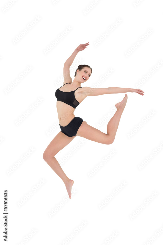 Sporty young woman jumping isolated on white background Sporty young woman jumping isolated on white background