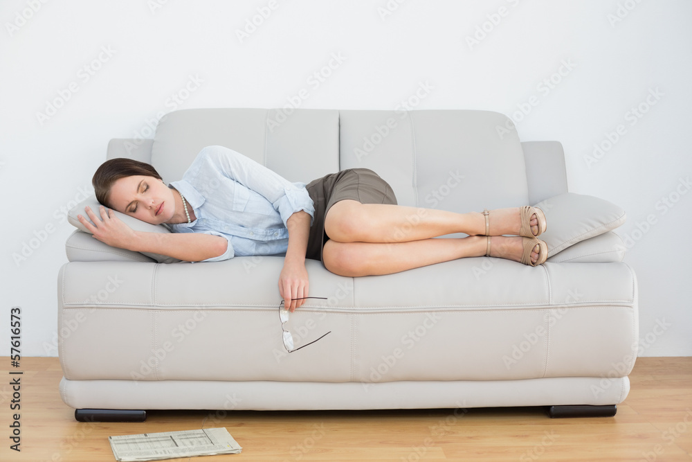 Well dressed young woman sleeping on sofa Well dressed young woman sleeping on sofa