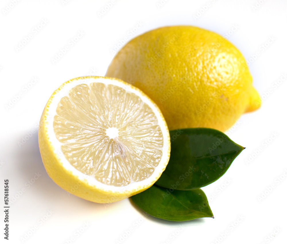 Lemon with leaves on white