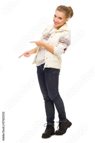Young smiling girl shows pointing gesture