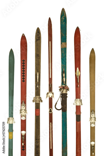 Vintage colorful used skis isolated on white