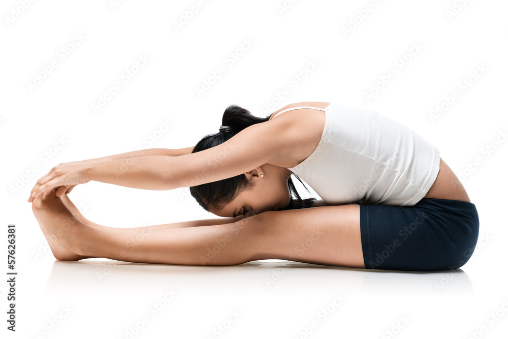  woman in pashchimottanasana yoga position