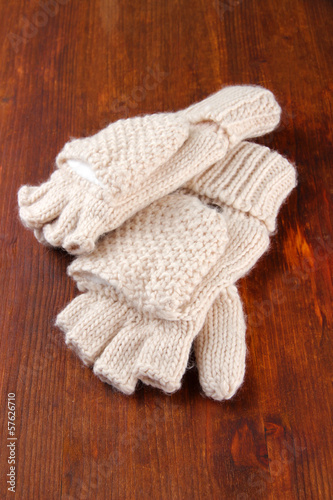 Wool fingerless gloves, on wooden background