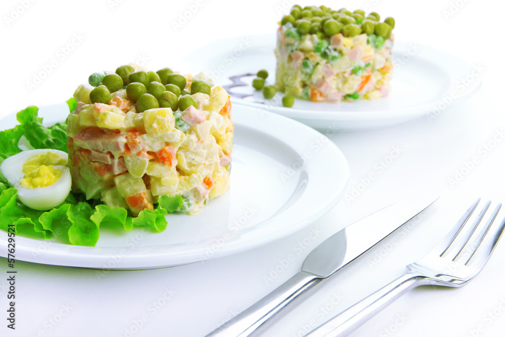 Russian traditional salad Olivier, isolated on white Russian traditional salad Olivier, isolated on white