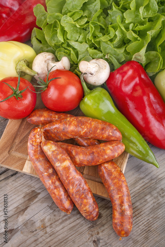 sausage with vegetables and salad