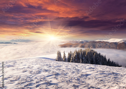 Spectacular sunrise among a sea of ​​fog in the winter Carpa