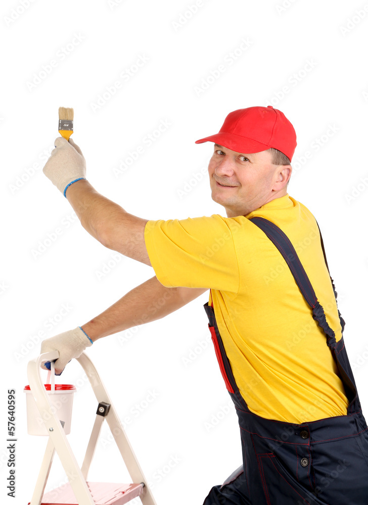 Worker on ladder with brush and bucket Worker on ladder with brush and bucket