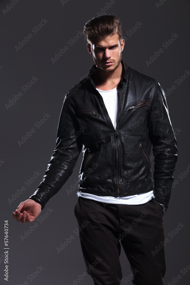 young fashion male model in leather jacket posing young fashion male model in leather jacket posing