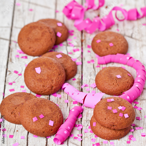 fresh chocolate cookies, pink ribbons and confetti