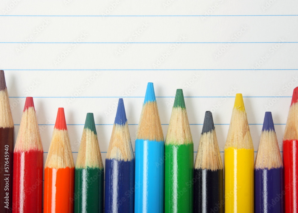 Fototapeta premium Coloured Drawing Pencils on Lined Paper