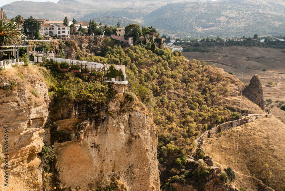 White spanish buildings built on the cliffs edge at Ronda, Spain